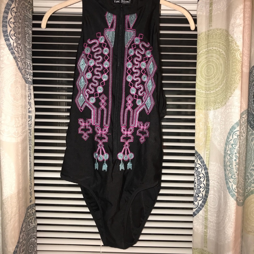 Zip up swimsuit embroidered design. Just too small